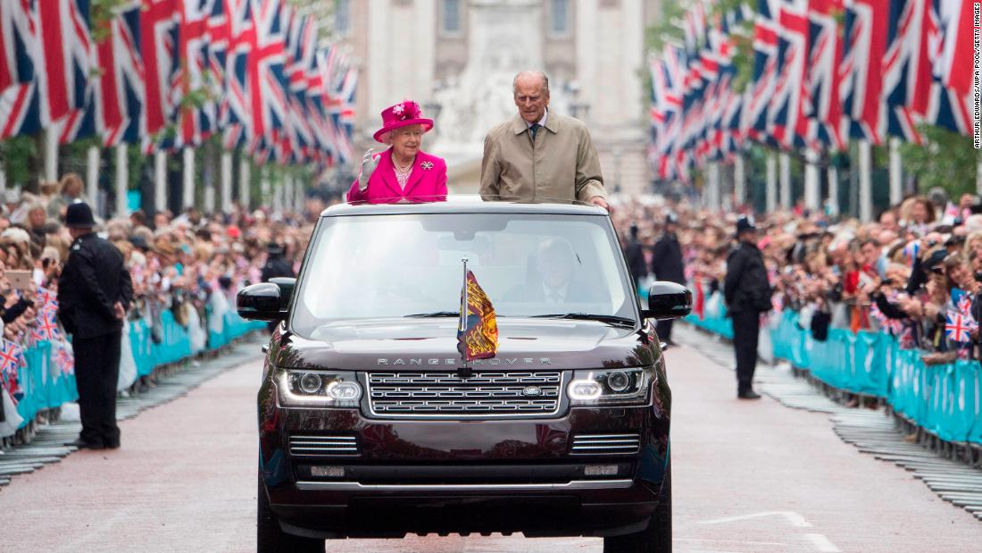 The Queen and Prince Philip wave to guests in June 2016, during celebrations for her 90th birthday.