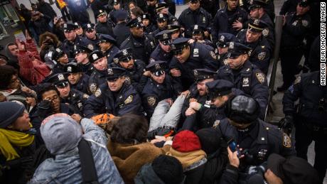 In this December 2014 image, New York police clash with demonstrators protesting the decision not to indict the officer involved in the chokehold death of Eric Garner.