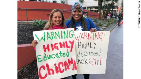   Christine Guzmán and Gyasmine George-Williams parade in Los Angeles. 