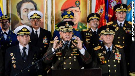 Venezuelan Defense Minister Vladimir Padrino, flanked by senior members of the country&#39;s military, speaks in support of President Nicolas Maduro on Thursday.