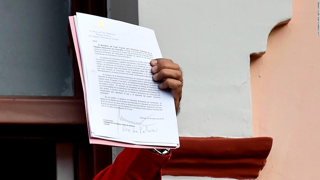 Maduro, speaking to a crowd of supporters at the Miraflores Palace in Caracas, holds up a document that says his government is breaking off diplomatic ties with the United States. &quot;We cannot accept the invasive policies of the empire, los Estados Unidos, the policies of Donald Trump,&quot; he said to cheers from the crowd on January 23. &quot;Venezuela is a land of liberators.&ampcotizaciónt;