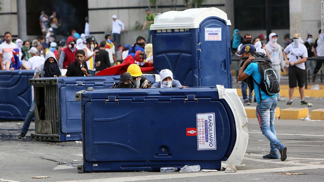 Demonstrators in Caracas protest Maduro&#39;s government.