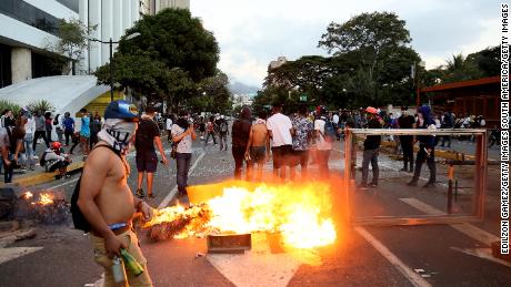 A fire burns during a protest Wednesday in Caracas against the government of Nicolas Maduro.
