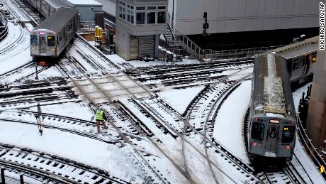   Chicago trains take snowy roads on Monday. 