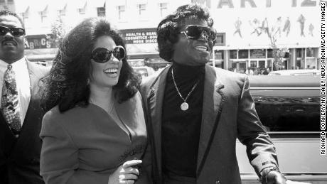 James Brown and wife Adrienne promote his new line of cookies.