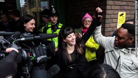 May MacKeith, a member of the so-called &#39;Stansted 15&#39; raises a fist as she leaves Chelmsford Crown Court.