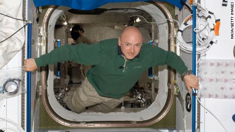 In this handout image provided by NASA, then-astronaut Mark Kelly floats in the hatch between the Harmony node and the newly installed Kibo Japanese Pressurized Module of the International Space Station. 