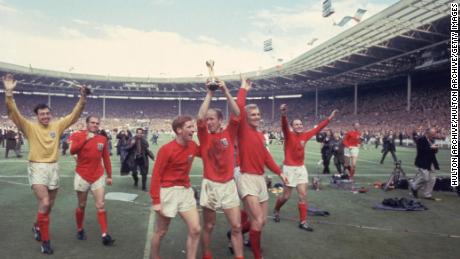 Bobby Charlton raises the Jules Rimet trophy in the air  following England&#39;s 4-2 victory after extra time over West Germany.