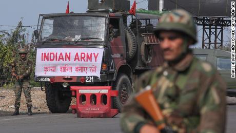 An Indian army soldier stands guard during a curfew in Jammu on February 18, 2019. - Indian authorities withdrew police protection for five separatist leaders in Kashmir on February 17 amid mounting fallout from a suicide bombing that killed 41 soldiers in the disputed region. New Delhi has vowed to retaliate after a van packed with explosives ripped through a convoy transporting 2,500 soldiers across the Indian-administered territory on February 14, the deadliest-ever attack in a 30-year-old armed conflict. (Photo by Rakesh BAKSHI / AFP)        (Photo credit should read RAKESH BAKSHI/AFP/Getty Images)