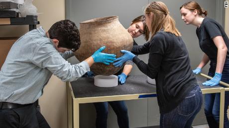 Students and staff from Indiana University and Purdue University in Indianapolis are busy managing artifacts found at a facility near Indianapolis.