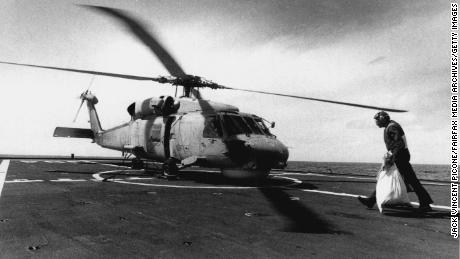 A chopper picks up mail bag to be taken to Diego Garcia in September, 1990. 
