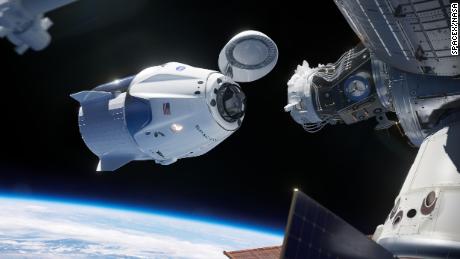 This rendering shows SpaceX&#39;s Crew Dragon linging up with its docking port at the ISS.