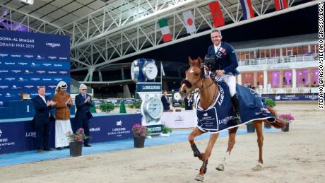 Julien Epaillard and  Usual Suspect d&#39;Auge during their lap of honor in Doha.