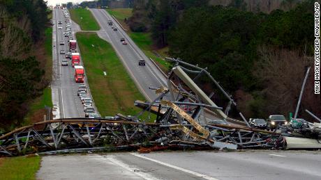A fallen cell tower lies across U.S. Route 280 highway in Lee County, Alabama after what appeared to be a tornado struck in the area.