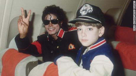 Michael Jackson with Jimmy Safechuck, age 10, on a touring plane in July 1988.