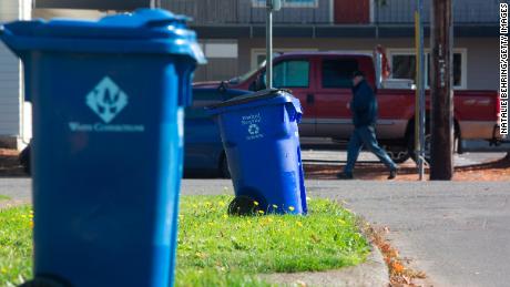 Blue recycling bins are seen on a residential street in Portland, Oregon. Coca-Cola will use the teachings of its Atlanta program to help it scale up its recycling efforts. 
