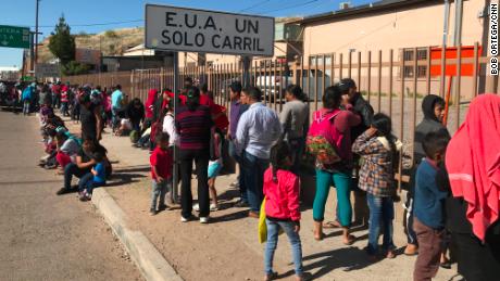 Migrants waited to be fed at a soup kitchen operated by the Kino Border Initiative in Nogales, Sonora. The wait to have an asylum bid heard at the border has soared since January. 