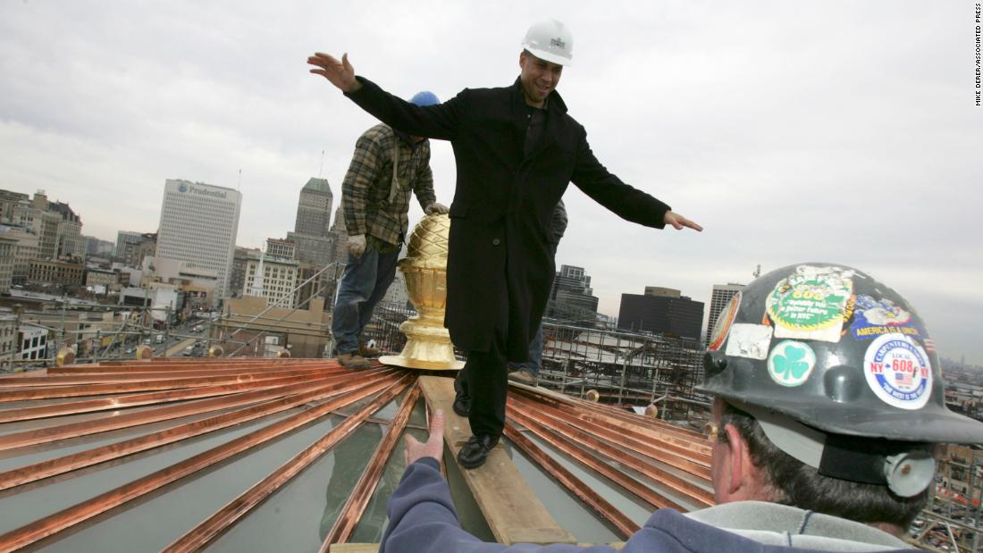 Booker walks on the newly refurbished City Hall dome in Newark in November 2006.