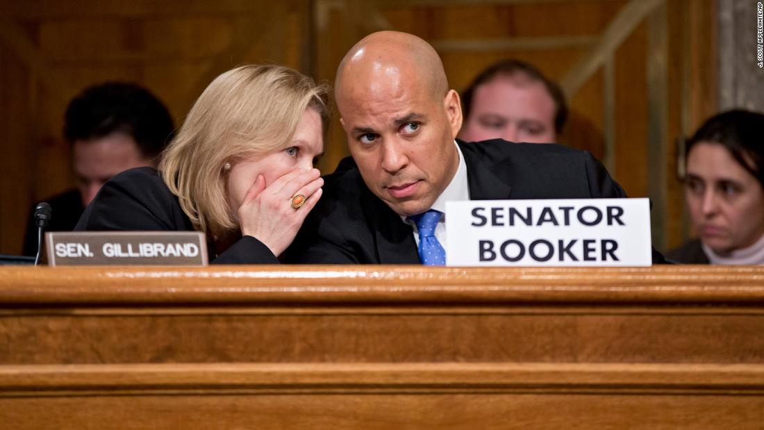 Booker confers with US Sen. Kirsten Gillibrand during a Senate subcommittee hearing in November 2013. The hearing, about Hurricane Sandy recovery efforts, was Booker&#39;s first since being sworn in.