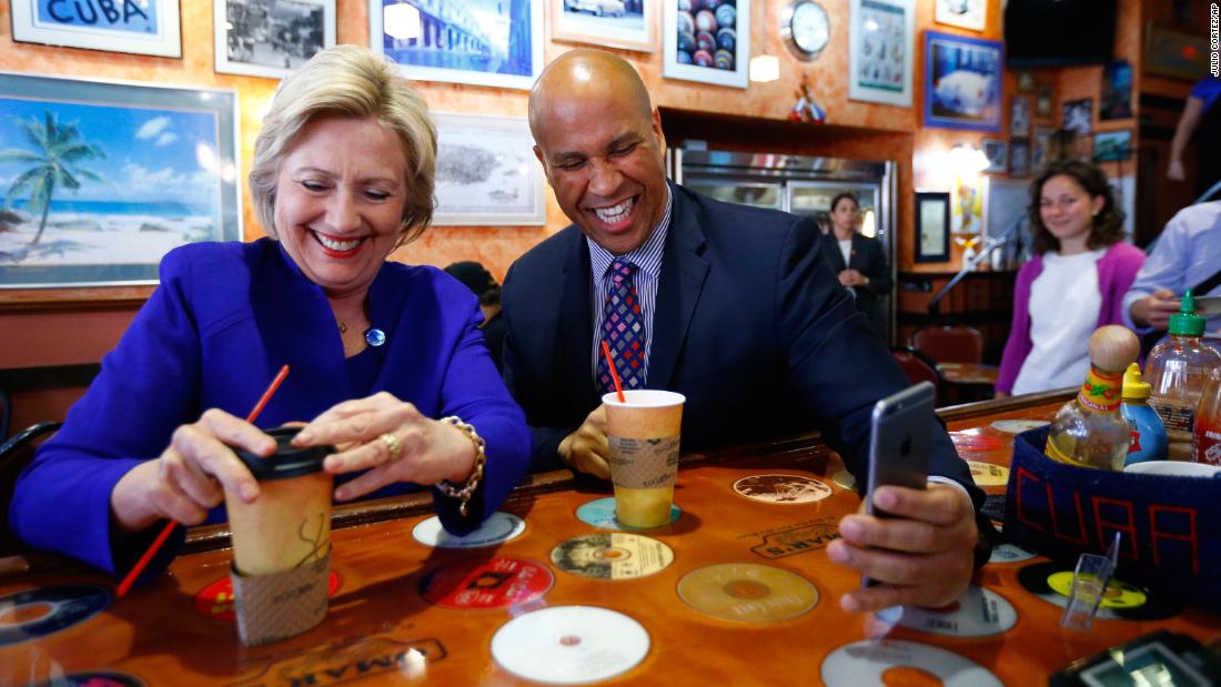 Booker campaigns with Democratic presidential candidate Hillary Clinton at a cafe in Newark in June 2016.