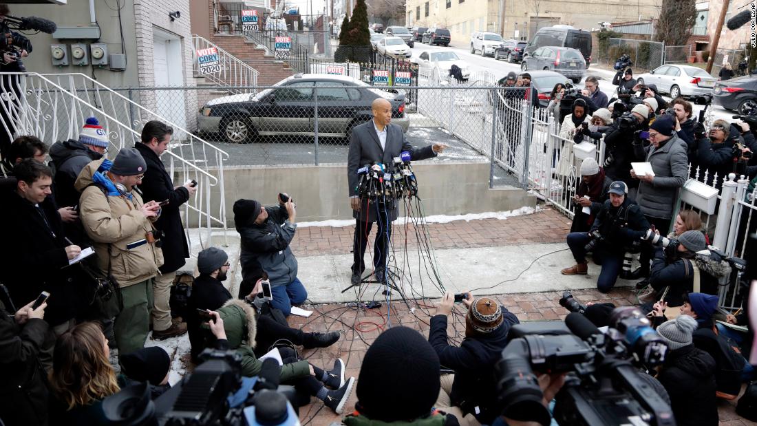 After announcing that he would be running for president, Booker speaks to the press outside his home in Newark in February 2019.