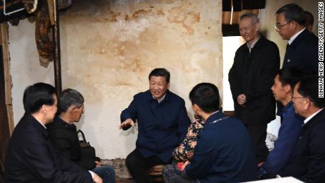 Chinese President Xi Jinping visits a villager&#39;s home to learn about the progress of poverty alleviation in Huaxi village on April 15.
