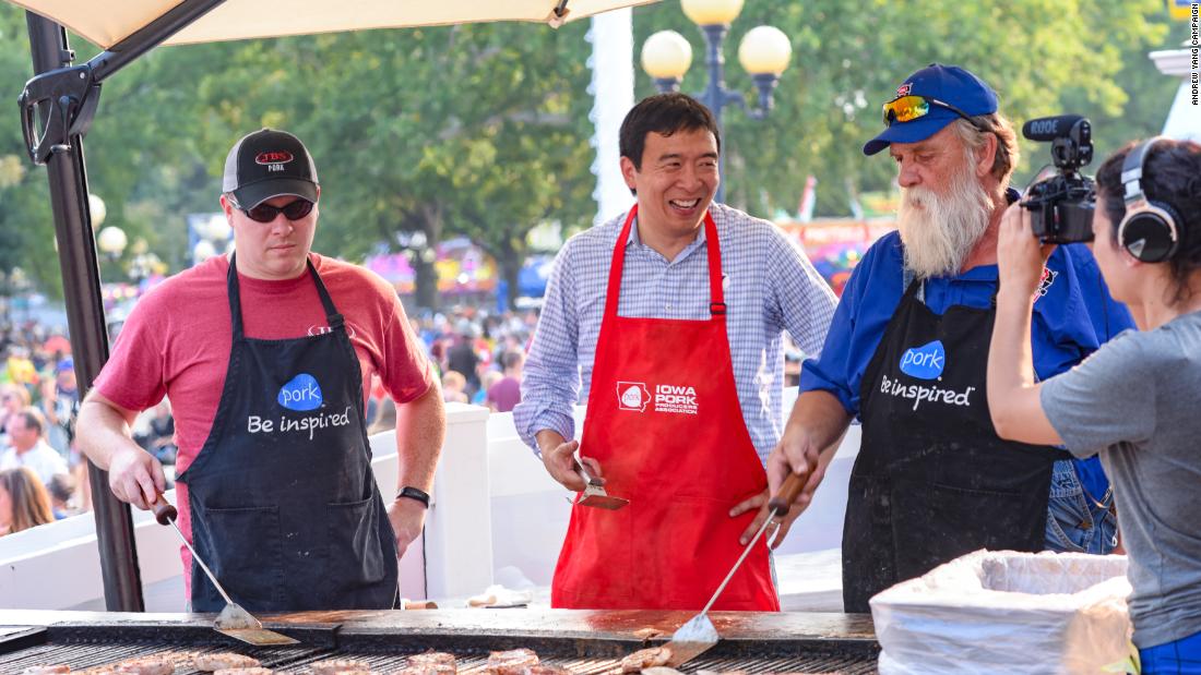 Yang helps man the grill at the Iowa State Fair.