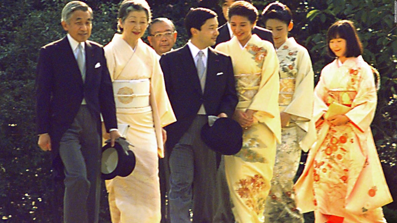 Emperor Akihito and Empress Michiko, left, lead their two sons, accompanied by their spouses, and a daughter during the annual autumn imperial garden party at Akasaka Palace in Tokyo in 1997.