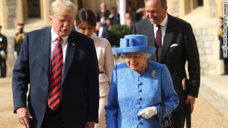WINDSOR, ENGLAND - JULY 13:  Queen Elizabeth II and President of the United States, Donald Trump walk from the Quadrangle after inspecting an honour guard at Windsor Castle on July 13, 2018 in Windsor, England.  Her Majesty welcomed the President and Mrs Trump at the dais in the Quadrangle of the Castle. A Guard of Honour, formed of the Coldstream Guards, gave a Royal Salute and the US National Anthem was played. The Queen and the President inspected the Guard of Honour before watching the military march past. The President and First Lady then joined Her Majesty for tea at the Castle.  (Photo by Chris Jackson/Getty Images)