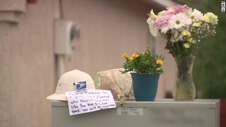 Flowers and a note were placed outside the house where the shooting took place.