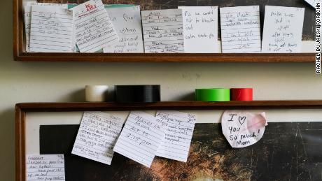 Notes posted in front of Whitney's bedroom door offer reminders about her treatment.