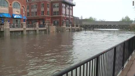 The edge of the Naperville River rises after heavy rains.