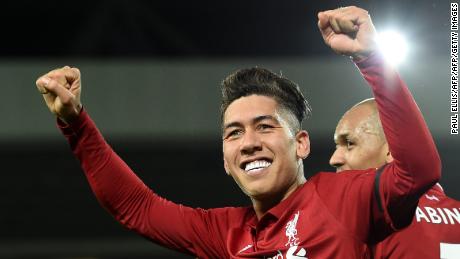 Roberto Firmino celebrates after scoring a hat-trick in his side&#39;s victory over Arsenal. 