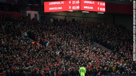 Messi looks dejected as the scoreboard reads &#39;4-0&#39; at Anfield.
