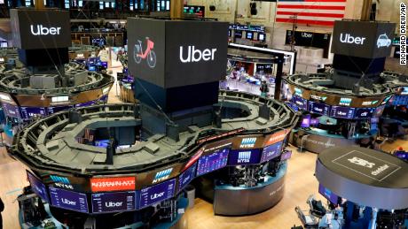 Uber logos occupy a prominent place on the floor of the New York Stock Exchange on Friday.