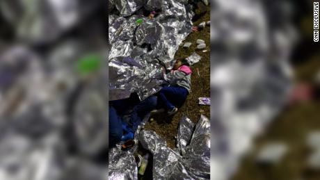 Exclusive photos reveal children sleeping on the ground at Border Patrol Station