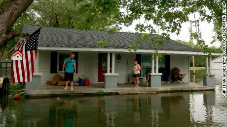 Nick Sweeney and his wife Tara monitor the water level after the flood of their home in Portage des Sioux, Missouri. 
