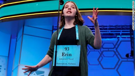 Erin Howard, 14, of Huntsville, Alabama, one of eight co-champions, reacts to her final word in the final round .