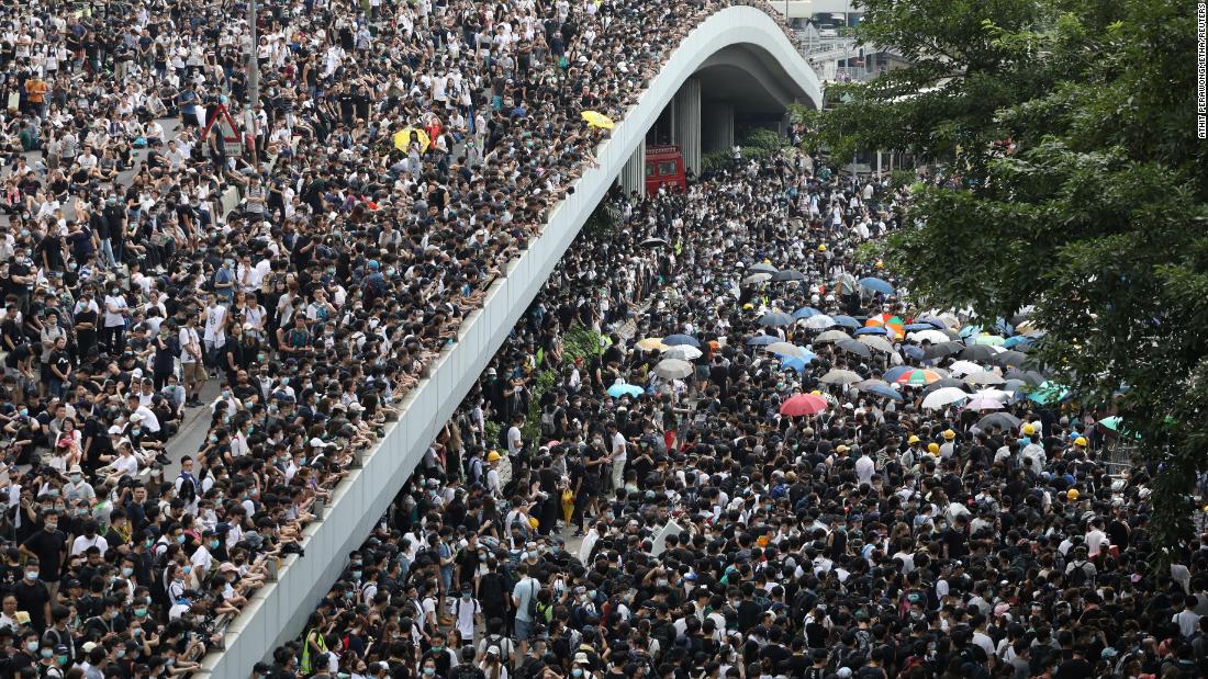 By the morning of June 12, tens of thousands of mainly young people had arrived in the area, blocking streets and bringing central Hong Kong to a standstill.