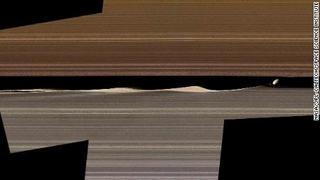 Between the rings of Saturn, on the right, is Daphnis, one of Saturn's sunken moons, and the waves she raises into Keeler's space. 