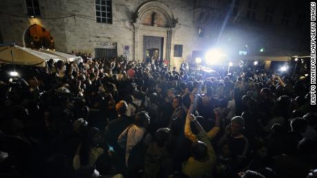 People and media gather outside Perugia&#39;s court before the appeal verdict is announced on October 3, 2011.