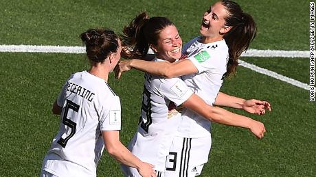 Melanie Leupolz (center) celebrates her goal in Marseille