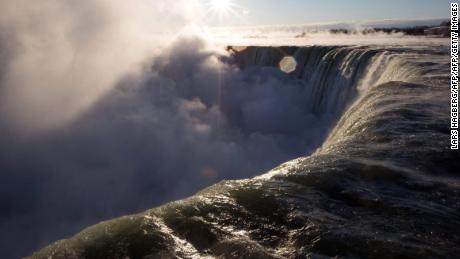 Man swept over Niagara Falls survives