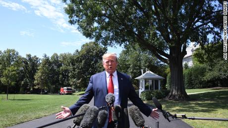US President Donald Trump speaks to the media as he departs the White House in Washington, DC, on August 21, 2019.