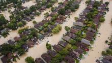 This aerial photo shows flooded residential neighborhoods in Houston.