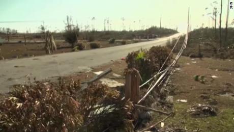 The fallen power lines are along the city road.