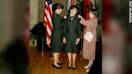 Maj. Gen. Maria Barrett and her mother, Clara Lodi, pin 2d Lt. rank on Paula Lodi during a commissioning ceremony at Rutgers University, 1990.