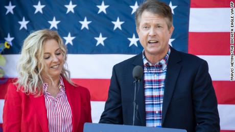 The US representative, Roger Marshall, R-Kan., Stands beside his wife, Laina, while he announces a race in the Senate.