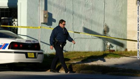 Police Lieutenant Steven Beres passes in the driveway where Laquetta Gunther's body was found in 2005.