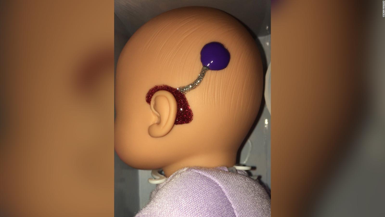 A teacher designed glittery hearing aids on dolls to make her deaf students feel represented